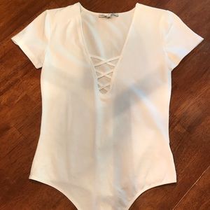 White leotard, never worn.